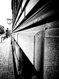 Long empty road along buildings