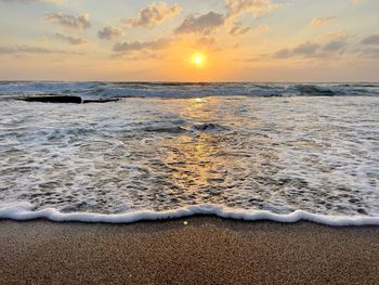 Scenic view of sea against sky during sunset