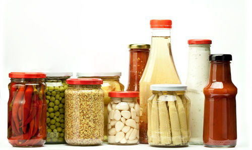 Close-up of bottles against white background