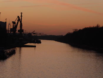 Scenic view of sea against orange sky