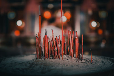 Close-up of burning candles in temple