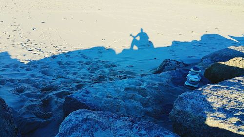 Shadow on person on beach