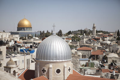 View of church and mosque amidst buildings