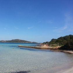 Scenic view of sea against blue sky