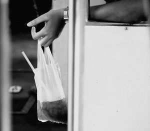 Close-up of hand holding cigarette