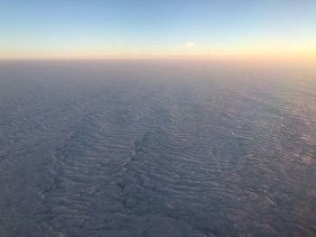 Aerial view of landscape against sky during sunset