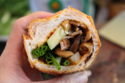 Close-up of hand holding bread