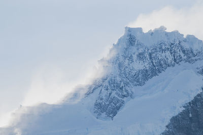 Snow covered mountains against sky