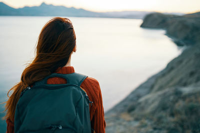 Rear view of woman looking at sea