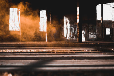 Old railroad tracks seen through window