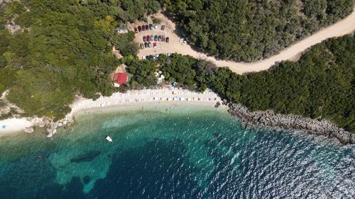 High angle view of trees by sea