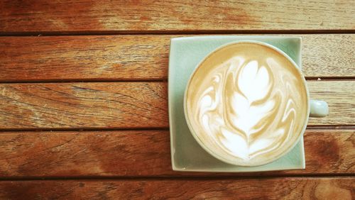 Directly above shot of cappuccino on table