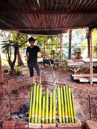 Full length of man standing by plants