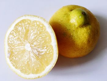 Close-up of lemon slice on white background