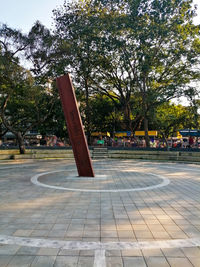 Empty park bench in city