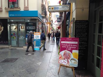 People walking on street in city