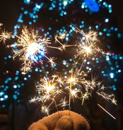 Low angle view of firework display at night