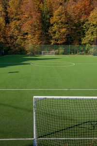 View of soccer field and trees during autumn