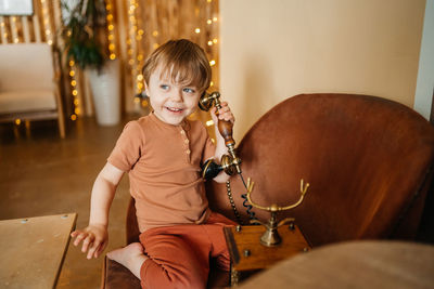 Little boy with antique phone. high quality photo