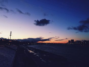 Silhouette of city at sunset