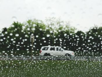 Water drops on car windshield during rainy season