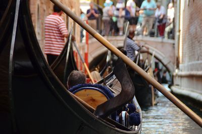 Reflection of man on boat in canal