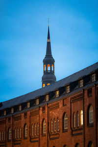 Low angle view of building against blue sky