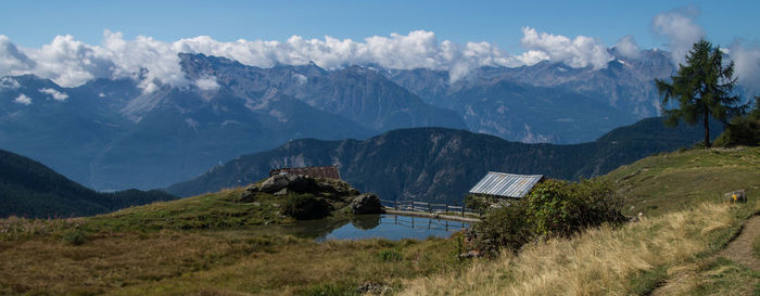 Countryside landscape against mountain range