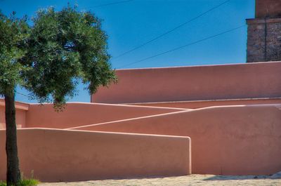 Low angle view of building against blue sky