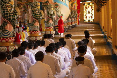 Group of people in temple outside building