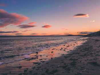 Scenic view of sea against sky at sunset