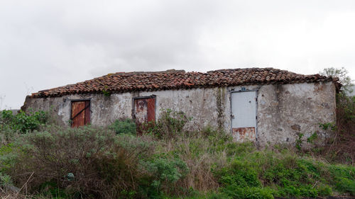 Abandoned building against sky