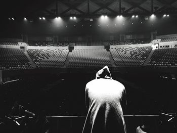 Rear view of dancer standing at stage