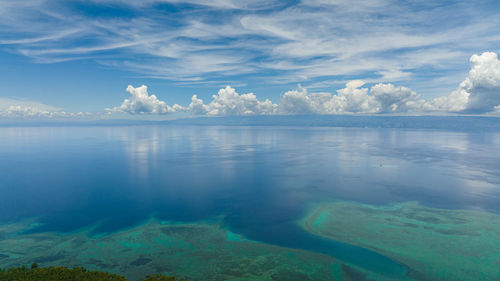 Aerial drone of the island of cebu from the sea. blue ocean and sky with clouds. 