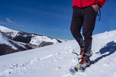 Snowshoeing scene in the italian alps