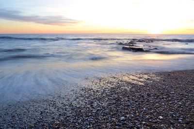 Scenic view of sea at sunset