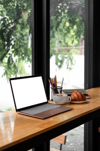 View of laptop on table at home