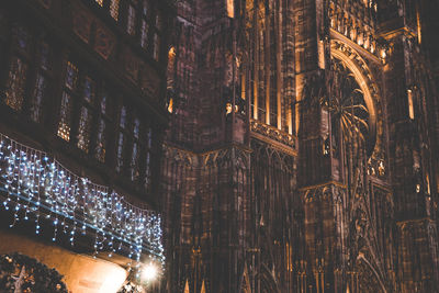 Low angle view of illuminated building at night