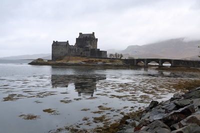 Buildings at waterfront during winter