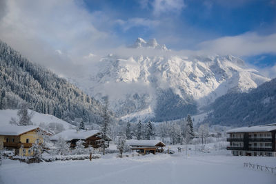 Scenic view of snow covered mountains against sky