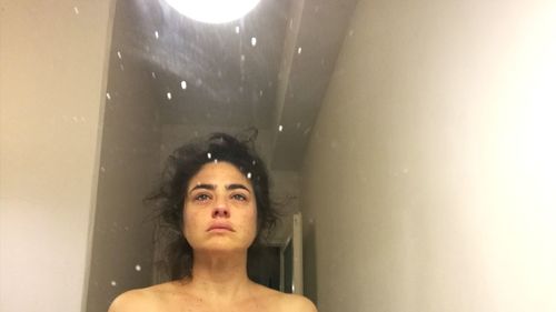 Portrait of woman in bathroom