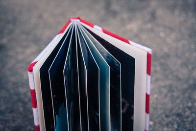 Close-up of hardcover book on road