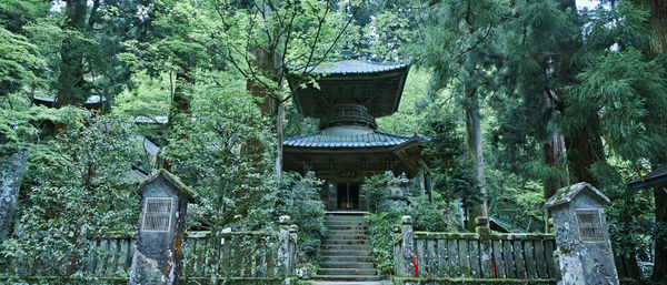 Gazebo by trees against building