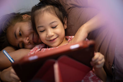 Portrait of happy girl with mobile phone