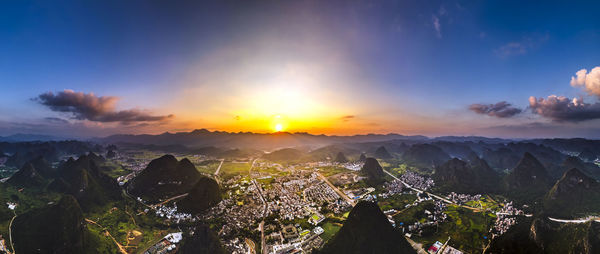 Panoramic view of buildings against sky during sunset