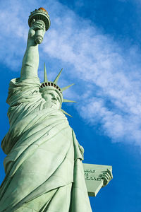 Low angle view of statue against cloudy sky