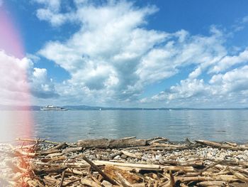 Scenic view of sea against cloudy sky