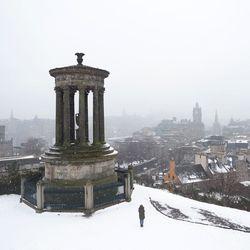 View of snow covered built structure against clear sky