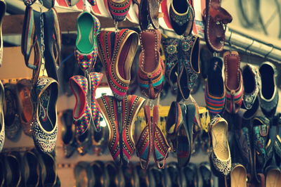 Close-up of shoes hanging at store