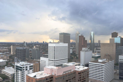 Modern buildings in city against sky